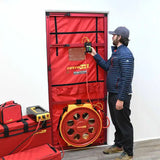 Technician running a Retrotec 7100 blower door test
