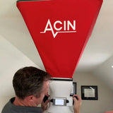 Technician measuring airflow with FlowFinder large hood